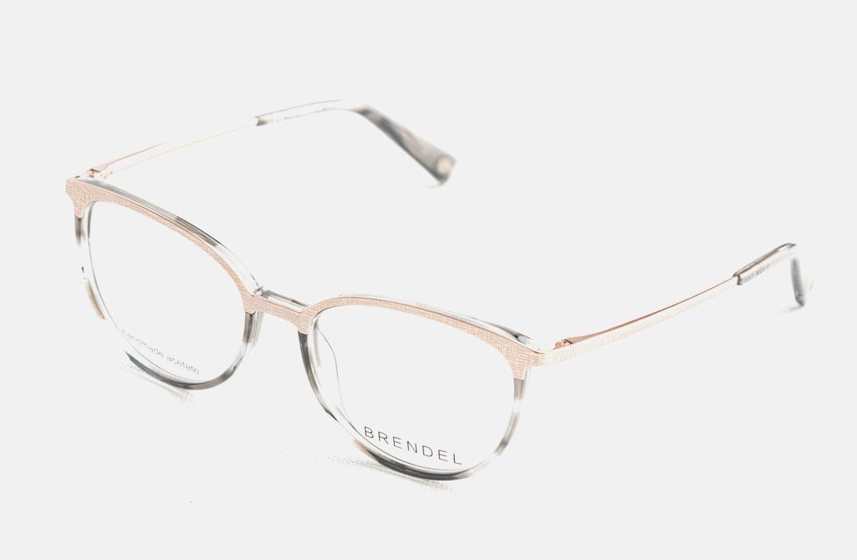 Thin metal-framed sunglasses on a plain white surface