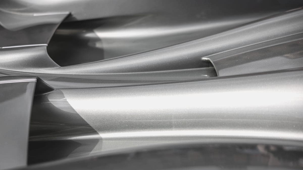 Polished titanium surface in cool, even daylight