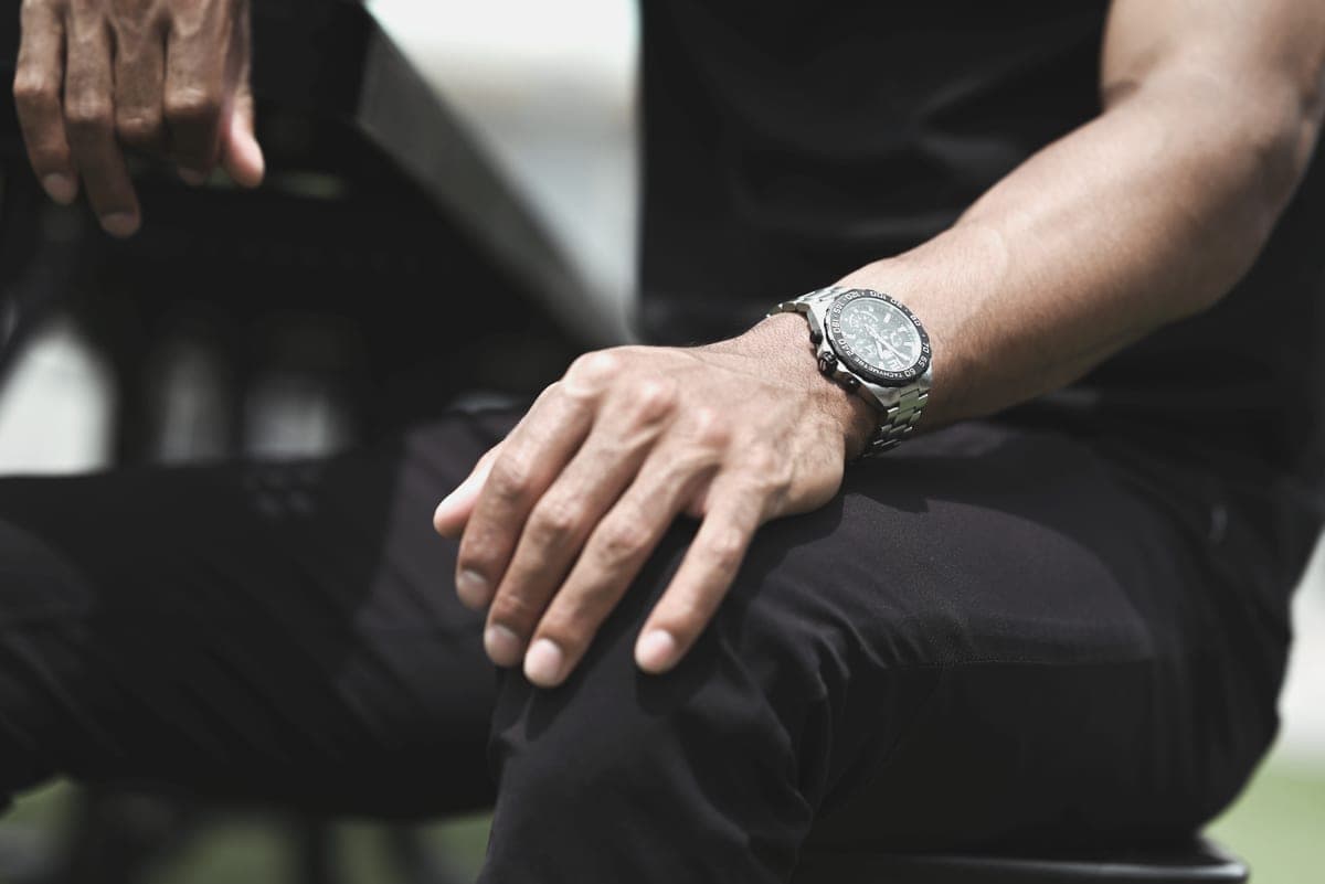 A wristwatch worn on a wrist, photographed in neutral daylight